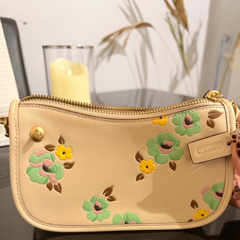 Coach Restored Swinger 20
With Floral Print